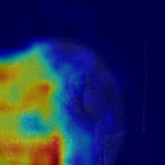 Standard GradCAM heat map over the same frame, with the hot region to the left of the subject.